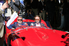 A special moment: father and son aboard their Ferrari 335 S by Scaglietti, enjoying Simon Kidston's expert commentary during the parade presentation.