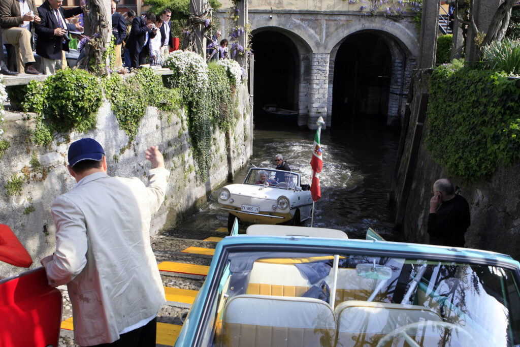 Moods at Villa d’Este. Between manicured gardens and soft ripples of Lago di Como, curiosity and delight took center stage. Four Amphicars and a rare VW Type 166 "Schwimmwagen" gently bobbed in the water, turning heads and stirring laughter. Guests discovered what it truly means to drive on water — equal parts charm and audacity. Concorso d'Eleganza Villa d'Este 2010.