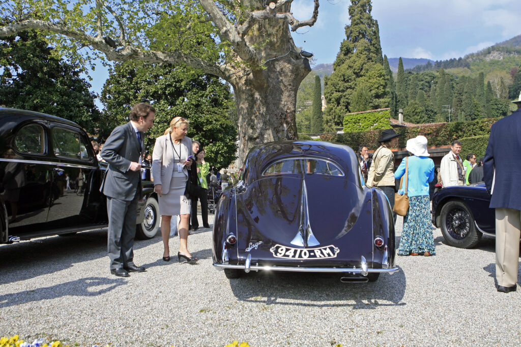 Nathalie Vranken – CEO of Vranken Pommery Monopole – carefully inspects a Talbot-Lago T150 C SS with the iconic Figoni & Falaschi teardrop bodywork. This example wins not only Best of Show, but as well Trofeo BMW Group Italia By Public Referendum at Villa Erba. Concorso d'Eleganza Villa d'Este 2010.
