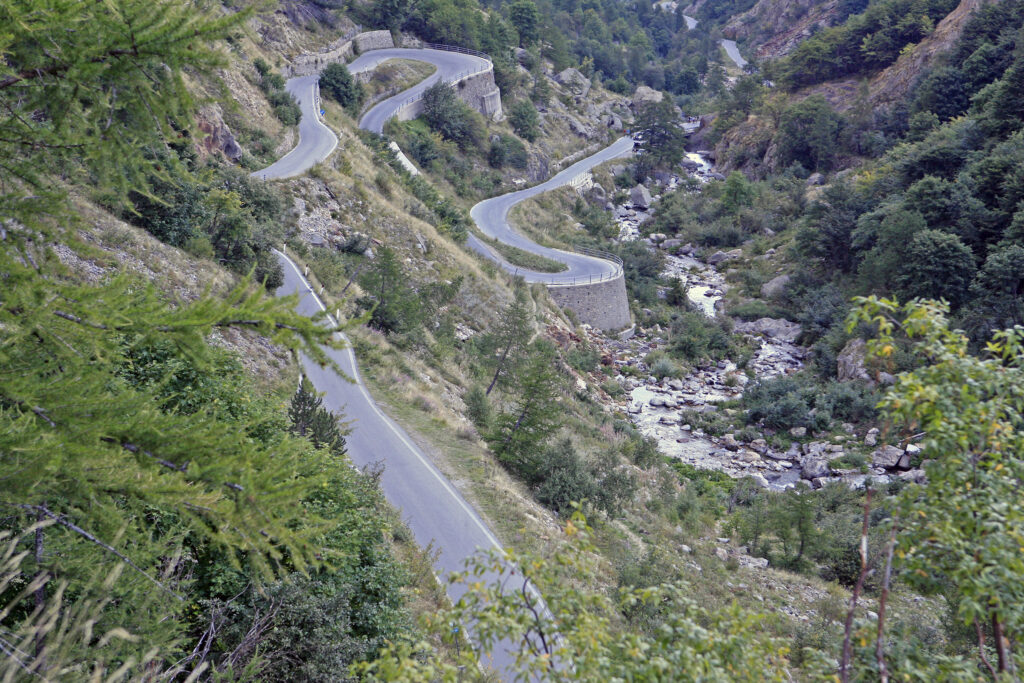 Our must drives list to add to Route des Grandes Alpes. A must-drive to add to the Route des Grandes Alpes. Tackling this pass feels like entering new territory, a pure driving arena where every curve is as beautifull as the landscape around. Here at out ensational Heights, Lunar Landscapes & Unforgetable Resorts Tour into Italy.
